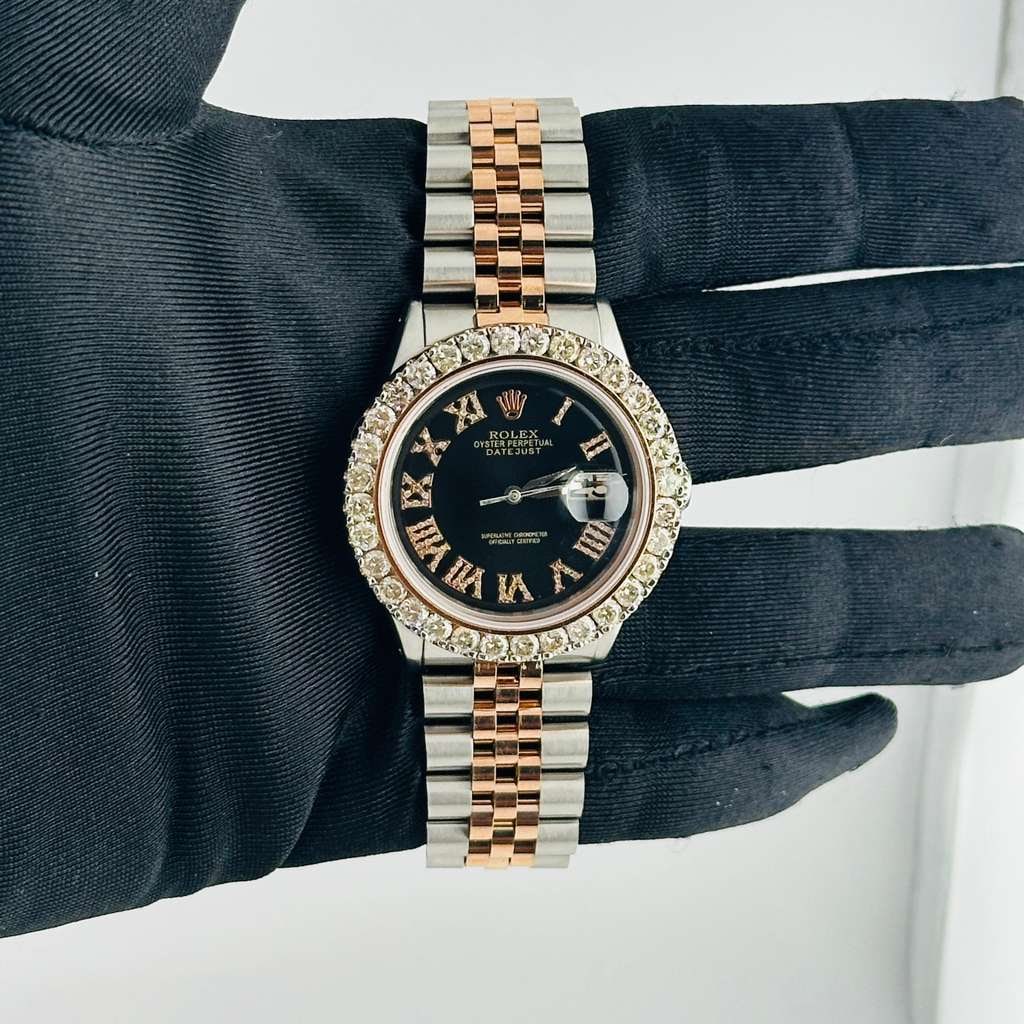 Aftermarket Black Roman Diamond Dial for Rolex Datejust Reference 1601: Aftermarket Black Roman Diamond Dial for Rolex Datejust Reference 1601 This Rolex Datejust features a customized black dial with Roman numerals and diamond accents. The watch is equipped with a prong 