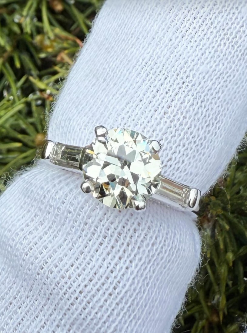 GIA Certified Platinum Ring with Old European and Baguette Diamonds 2.07ctw: GIA Certified Platinum Ring with Old European and Baguette Diamonds 2.07ctw This vintage women's engagement ring features a 1.72 carat natural Old European cut diamond, certified by GIA with K color a