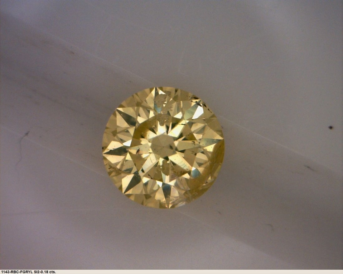 Loose Diamond - ROUND 0.18ct Fancy Greenish Yellow: Loose Diamond - ROUND 0.18ct Fancy Greenish Yellow Source: Natural Shape: ROUND Carats: 0.18 Color: Fancy Greenish Yellow Certification: GIA The Diamond Depot Guarantee: All items in this auction are 