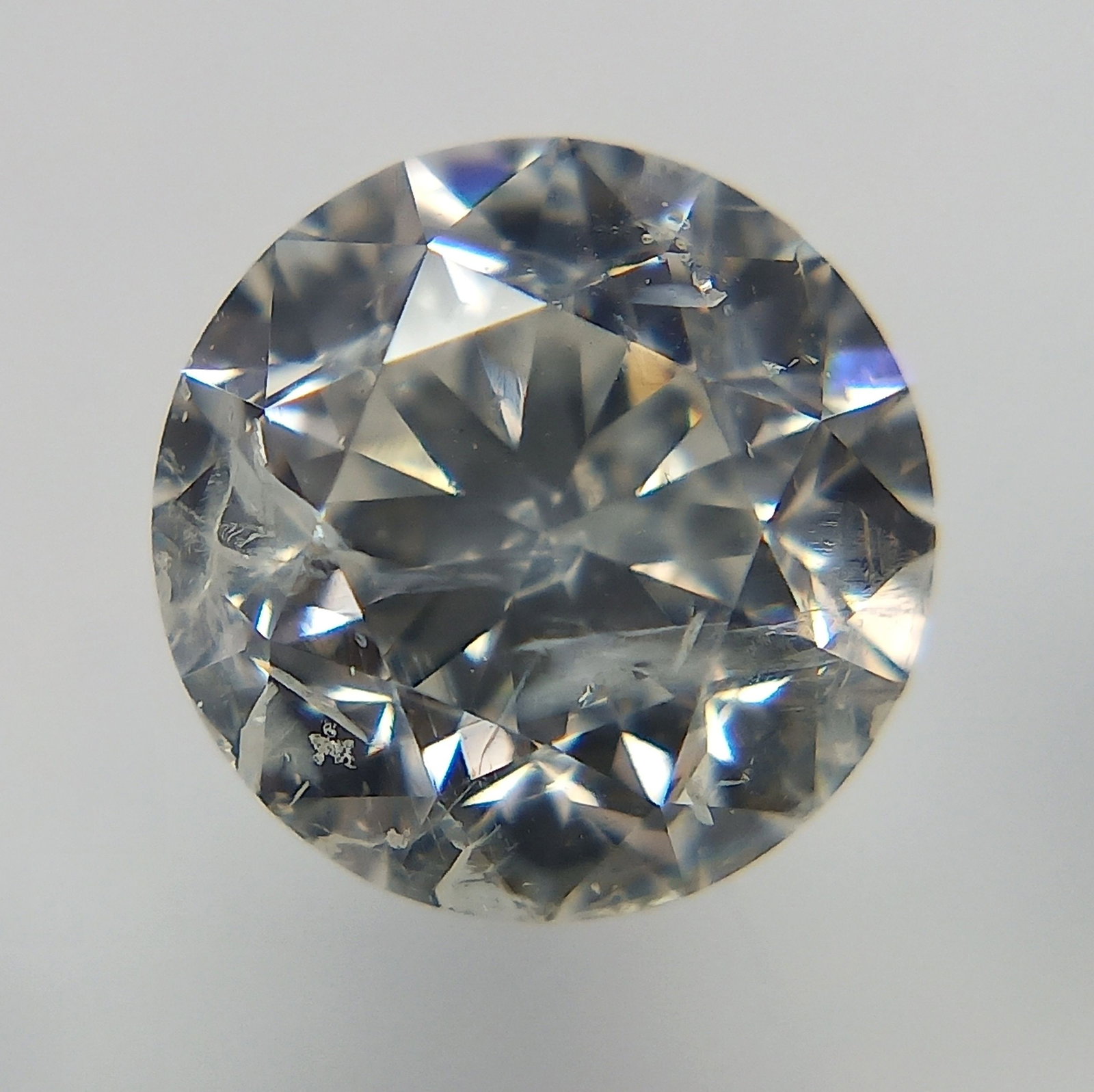 Loose Diamond - ROUND 1.01ct F I2: Loose Diamond - ROUND 1.01ct F I2 Source: Natural Shape: ROUND Carats: 1.01 Color: F Clarity: I2 Certification: IGI The Diamond Depot Guarantee: All items in this auction are guaranteed to be 100% aut