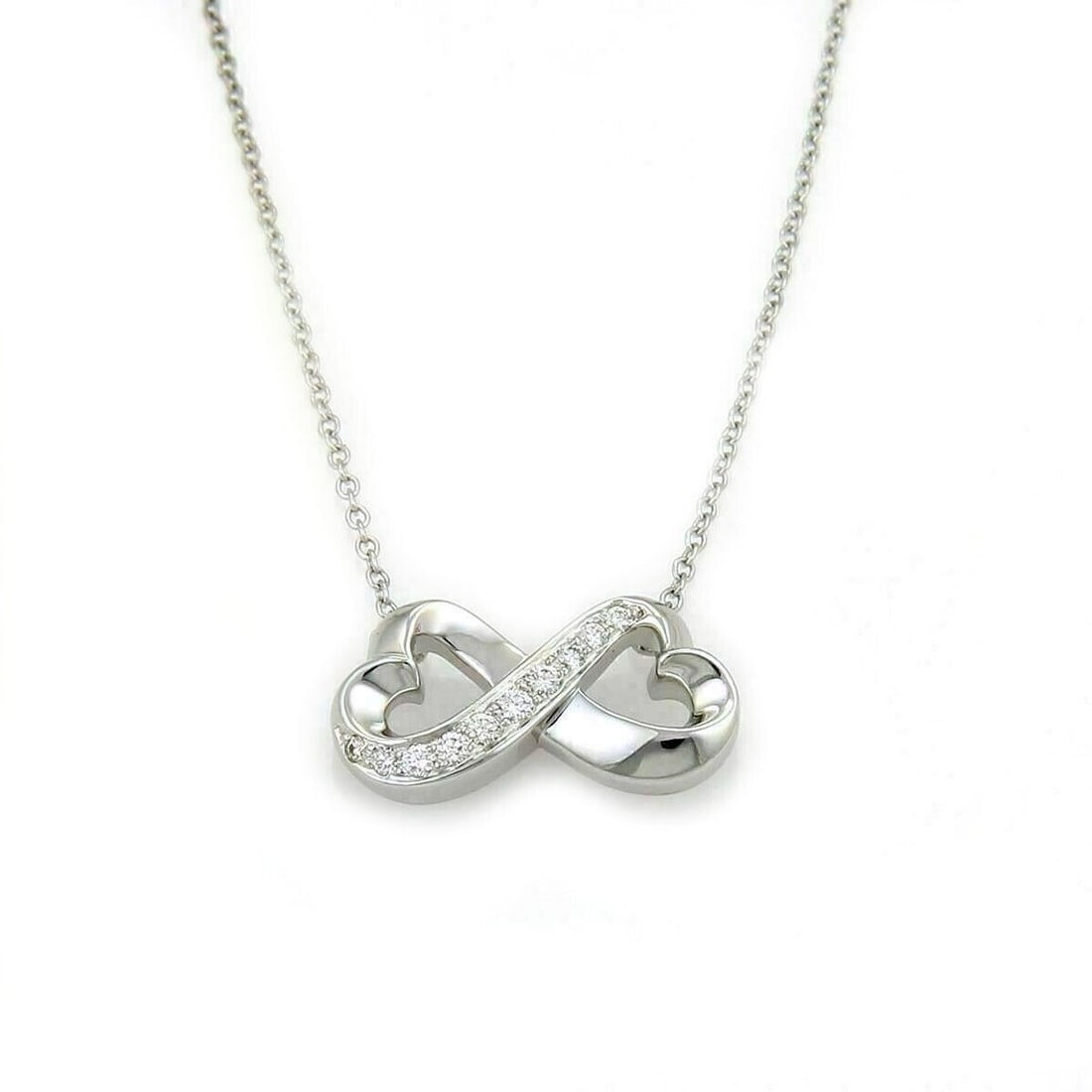 Picasso Loving Heart Diamond Pendant Necklace in 18k White Gold by Tiffany & Co.: Picasso Loving Heart Diamond Pendant Necklace in 18k White Gold by Tiffany & Co. This Tiffany & Co. Picasso Loving Heart pendant necklace features a heart motif designed by Paloma Picasso, set with a 