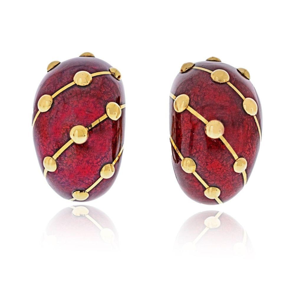 Schlumberger Red Enamel Banana Earrings in 18K Yellow Gold by Tiffany & Co.: Schlumberger Red Enamel Banana Earrings in 18K Yellow Gold by Tiffany & Co. These Tiffany & Co. Schlumberger banana clip-on earrings are crafted in 18K yellow gold and feature a striking red enamel de