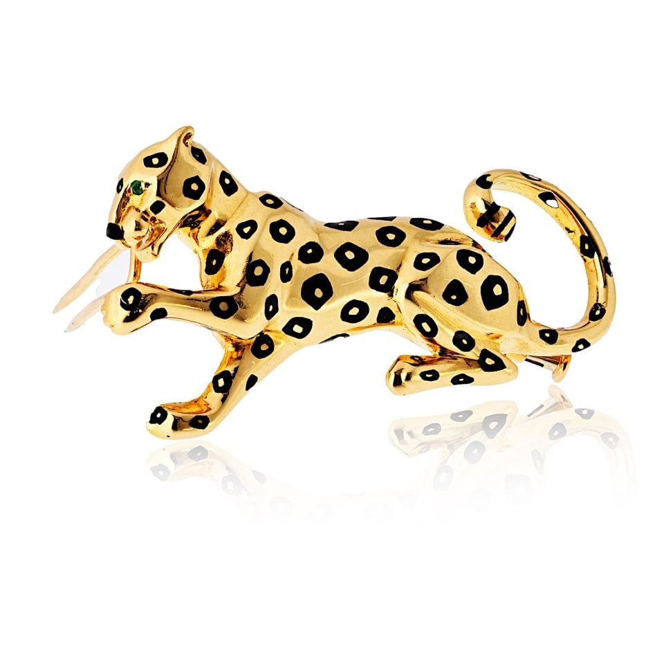 Cartier 18K Yellow Gold Panther Black Enamel Brooch: Cartier 18K Yellow Gold Panther Black Enamel Brooch Embrace your fierce side with this stunning Cartier Panthere brooch. Crafted from luxurious 18K yellow gold, this exquisite piece features a high po