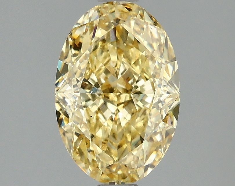 Loose Diamond - OVAL 2.07ct Fancy Vivid Yellow VS1: Loose Diamond - OVAL 2.07ct Fancy Vivid Yellow VS1 Source: This is a real non-mined Diamond that has been grown in a lab Shape: OVAL Carats: 2.07 Color: Fancy Vivid Yellow Certification: IGI Video: