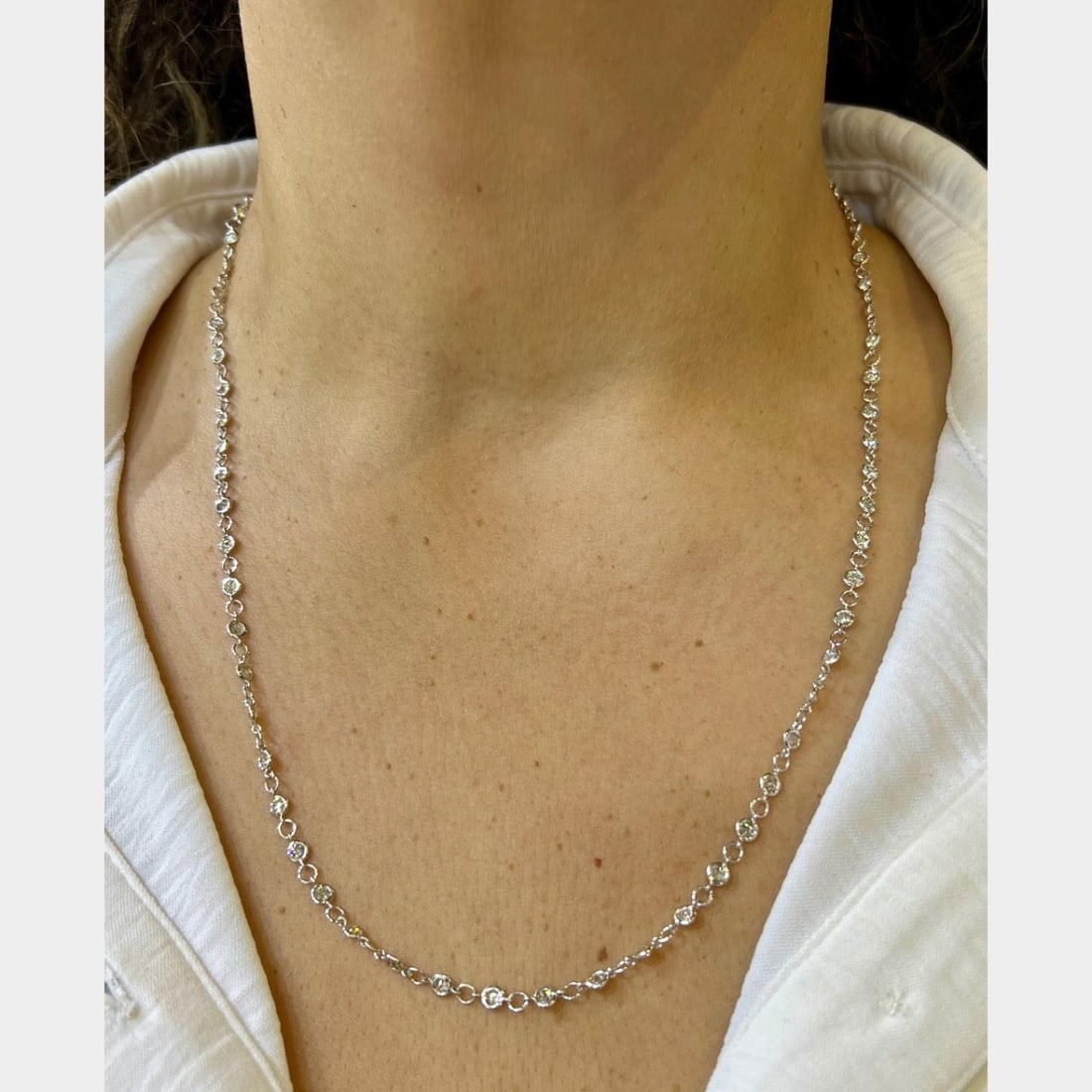 Diamond by the Yard Necklace in 18K White Gold 6.25 Carat 22 Inch: Diamond by the Yard Necklace in 18K White Gold 6.25 Carat 22 Inch This pre-owned necklace features 18K white gold and is set with a total of 79 diamonds. The piece includes 67 diamonds with a combined