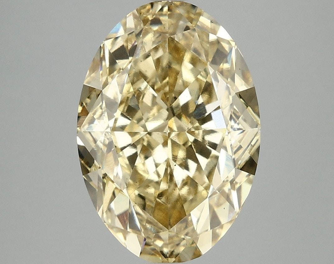 Loose Diamond - OVAL 6.1ct Fancy Vivid Yellow VS2: Loose Diamond - OVAL 6.1ct Fancy Vivid Yellow VS2 Source: This is a real non-mined Diamond that has been grown in a lab Shape: OVAL Carats: 6.1 Color: Fancy Vivid Yellow Certification: IGI Video: