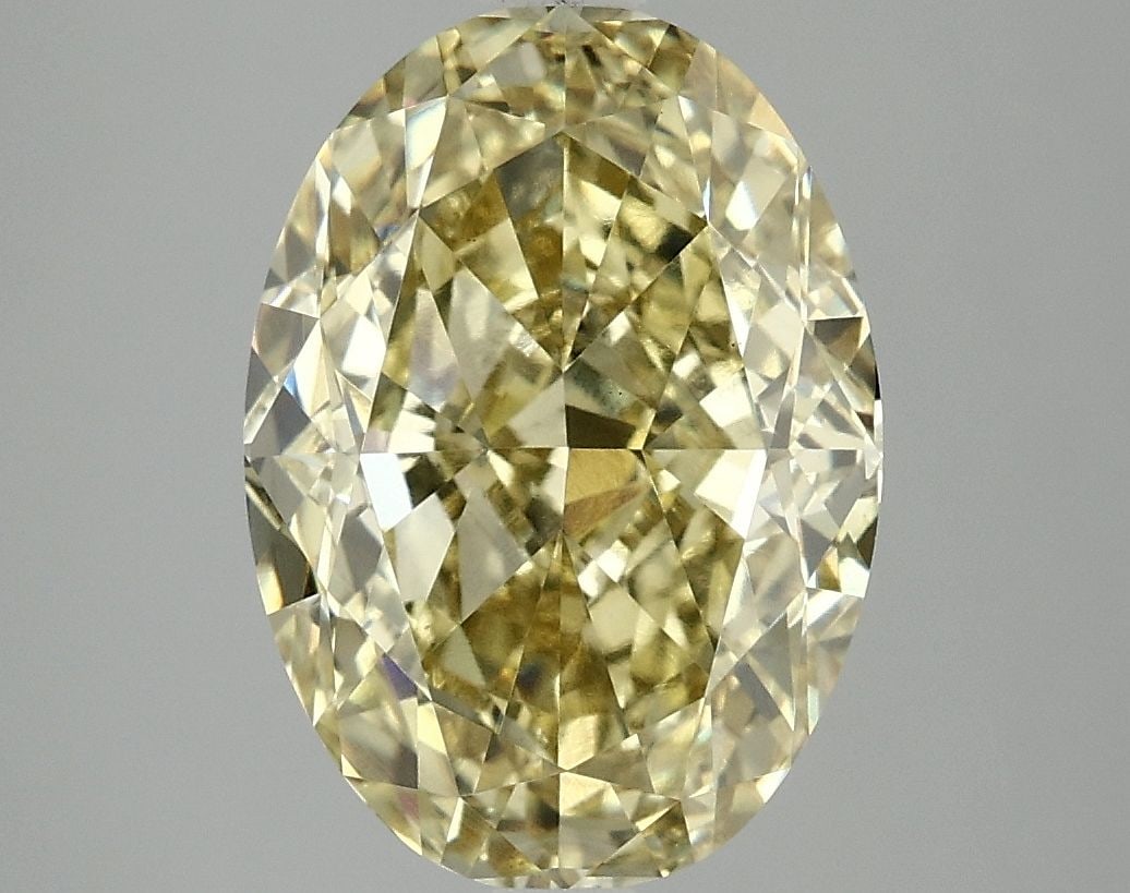 Loose Diamond - OVAL 5.07ct Fancy Vivid Yellow VS1: Loose Diamond - OVAL 5.07ct Fancy Vivid Yellow VS1 Source: This is a real non-mined Diamond that has been grown in a lab Shape: OVAL Carats: 5.07 Color: Fancy Vivid Yellow Certification: IGI Video: