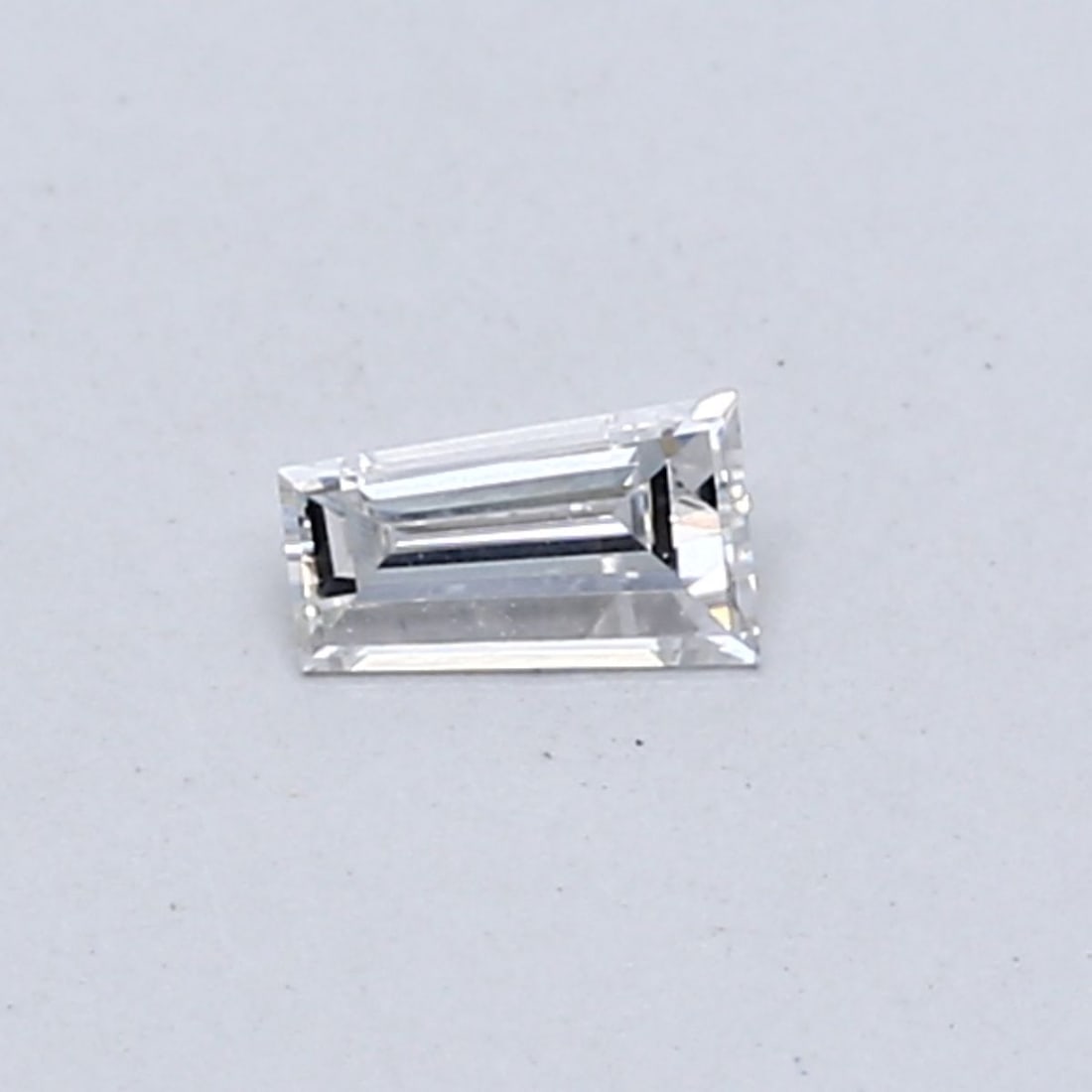 Loose Diamond - TAPERED BAGUETTE 0.16ct F VS1: Loose Diamond - TAPERED BAGUETTE 0.16ct F VS1 Source: This is a real non-mined Diamond that has been grown in a lab Shape: TAPERED BAGUETTE Carats: 0.16 Color: F Clarity: VS1 Certification: NONE The D