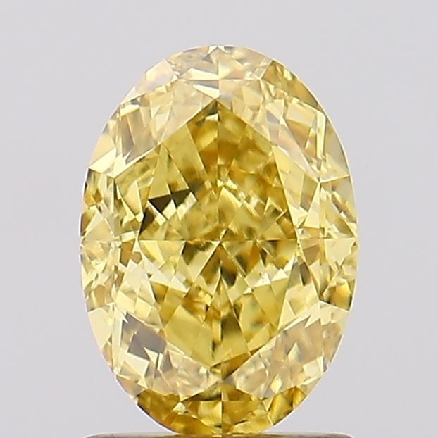 Loose Diamond - OVAL 1.65ct Fancy Vivid Yellow VVS2: Loose Diamond - OVAL 1.65ct Fancy Vivid Yellow VVS2 Source: This is a real non-mined Diamond that has been grown in a lab Shape: OVAL Carats: 1.65 Color: Fancy Vivid Yellow Certification: IGI Video: