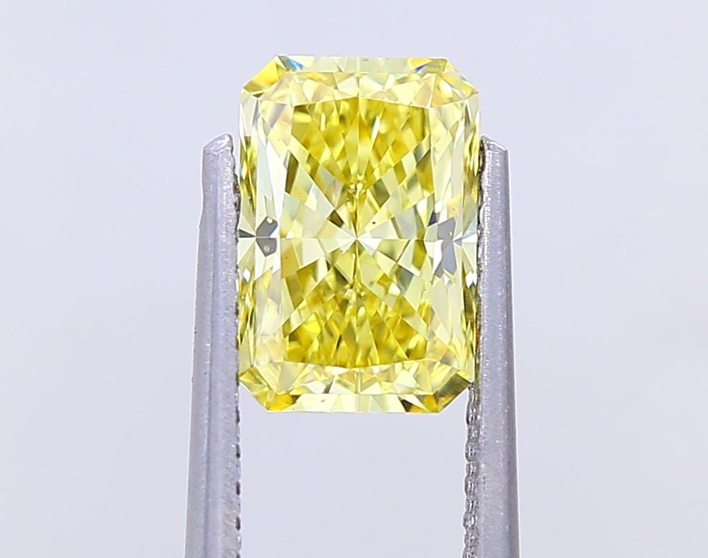 Loose Diamond - RADIANT 1.39ct Fancy Vivid Yellow VS1: Loose Diamond - RADIANT 1.39ct Fancy Vivid Yellow VS1 Source: This is a real non-mined Diamond that has been grown in a lab Shape: RADIANT Carats: 1.39 Color: Fancy Vivid Yellow Certification: IGI Vid