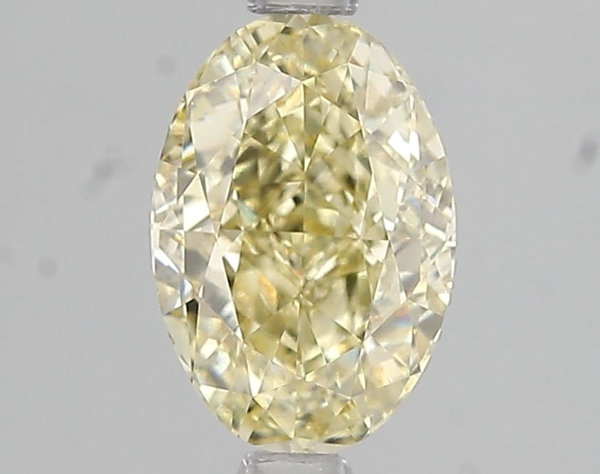Loose Diamond - OVAL 1.73ct Fancy Light Yellow VS1: Loose Diamond - OVAL 1.73ct Fancy Light Yellow VS1 Source: This is a real non-mined Diamond that has been grown in a lab Shape: OVAL Carats: 1.73 Color: Fancy Light Yellow Certification: IGI Video: