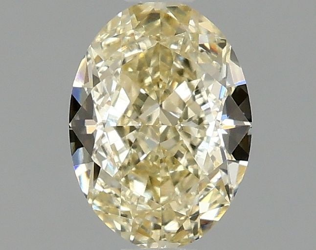 Loose Diamond - OVAL 1.1ct Fancy Light Yellow VVS2: Loose Diamond - OVAL 1.1ct Fancy Light Yellow VVS2 Source: This is a real non-mined Diamond that has been grown in a lab Shape: OVAL Carats: 1.1 Color: Fancy Light Yellow Certification: IGI Video: