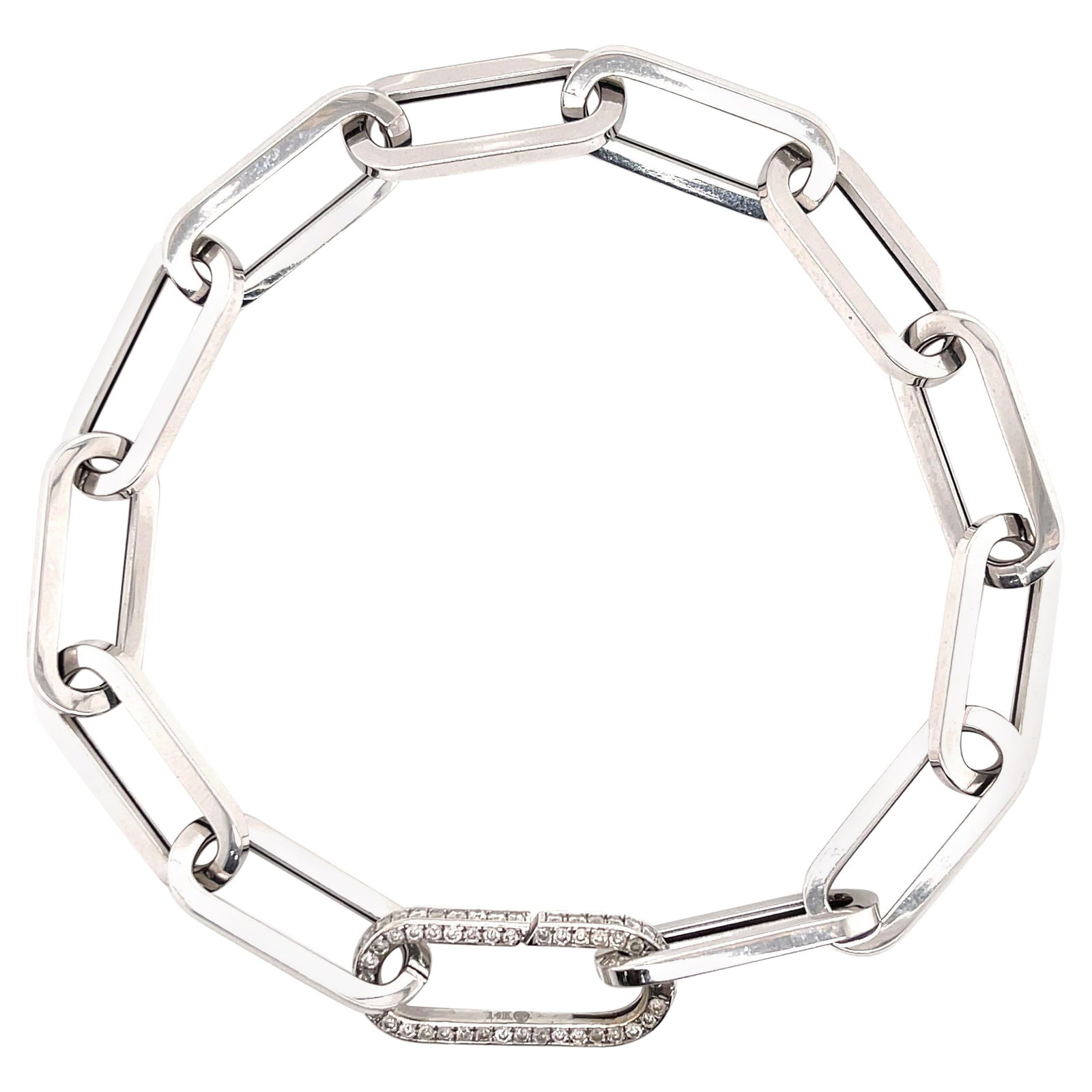 14K White Gold Italian Paperclip Bracelet with Diamond Clasp: 14K White Gold Italian Paperclip Bracelet with Diamond Clasp This exquisite Italian Flat Paperclip Link Bracelet is crafted from 14 karat white gold and features a stunning round cut diamond clasp. Th