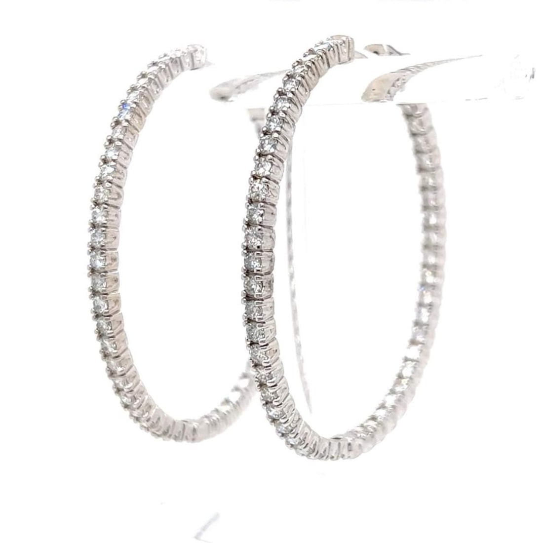 14K White Gold 5.50 Ct Diamond Hoop Earrings with 92 Stones: 14K White Gold 5.50 Ct Diamond Hoop Earrings with 92 Stones Elevate your elegance with these stunning 14K White Gold Hoop Earrings, adorned with a dazzling array of 92 diamonds totaling approximately 