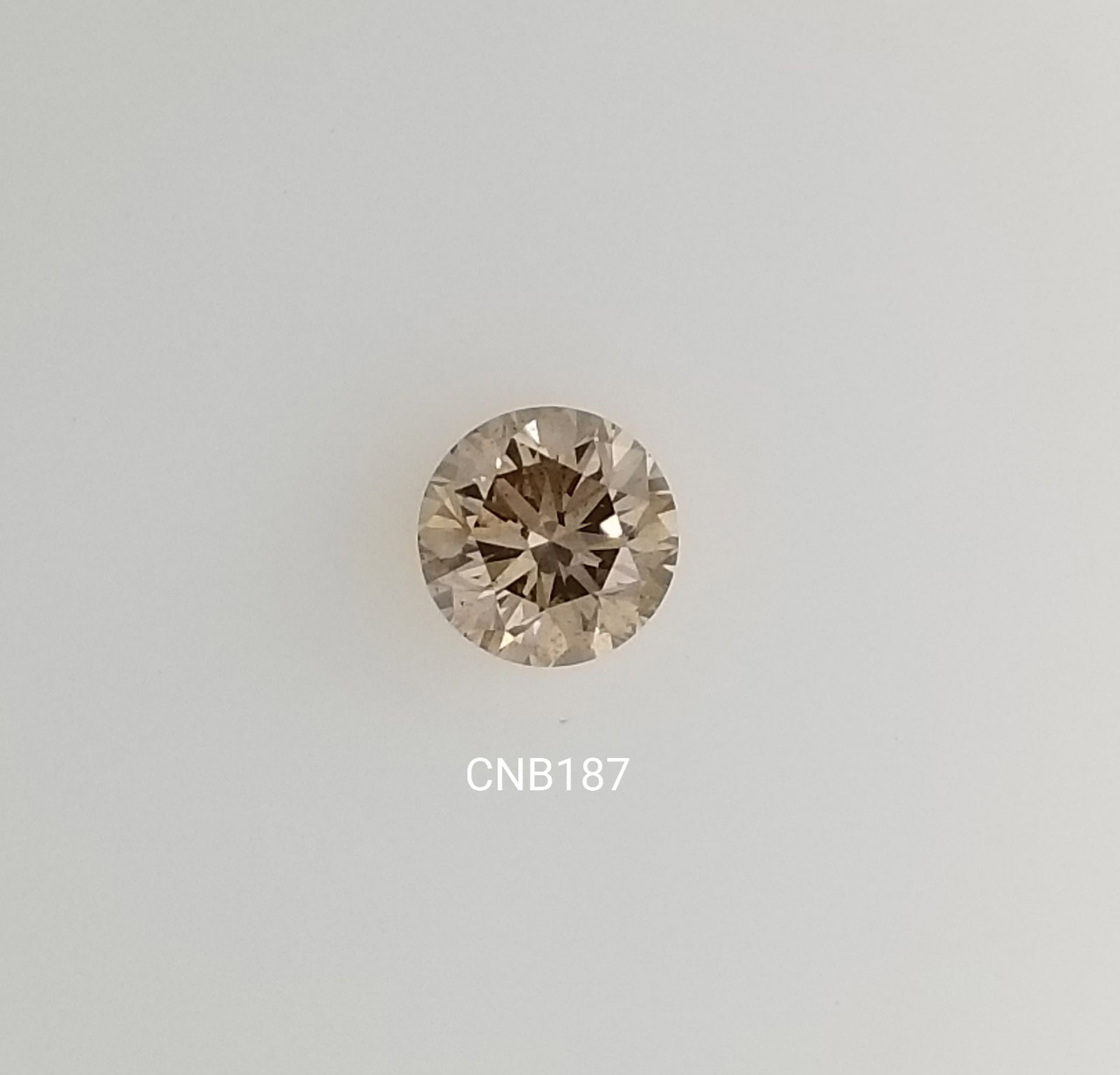 Loose Diamond - ROUND 0.96ct Faint Champagne SI1: Loose Diamond - ROUND 0.96ct Faint Champagne SI1 Source: Natural Shape: ROUND Carats: 0.96 Color: Faint Champagne Certification: NONE The Diamond Depot Guarantee: All items in this auction are guarant