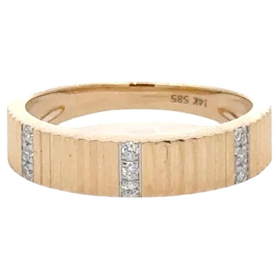 Contemporary 14K Yellow Gold Diamond Stackable Band Ring 0.06ct: Contemporary 14K Yellow Gold Diamond Stackable Band Ring 0.06ct This exquisite 14 karat yellow gold ring features a contemporary fluted design and showcases three rows of sparkling round cut diamonds 