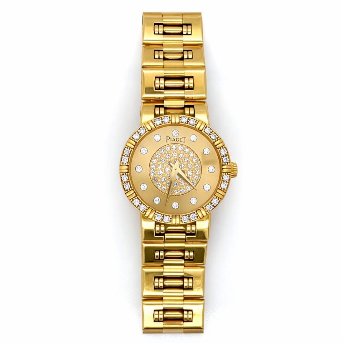Piaget Dancer Women's 18K Gold Quartz Watch with Diamond Bezel and Dial: Piaget Dancer Women's 18K Gold Quartz Watch with Diamond Bezel and Dial Piaget Dancer ladies watch crafted in 18K yellow gold, featuring a factory-set diamond bezel and dial. The watch has a 23mm case