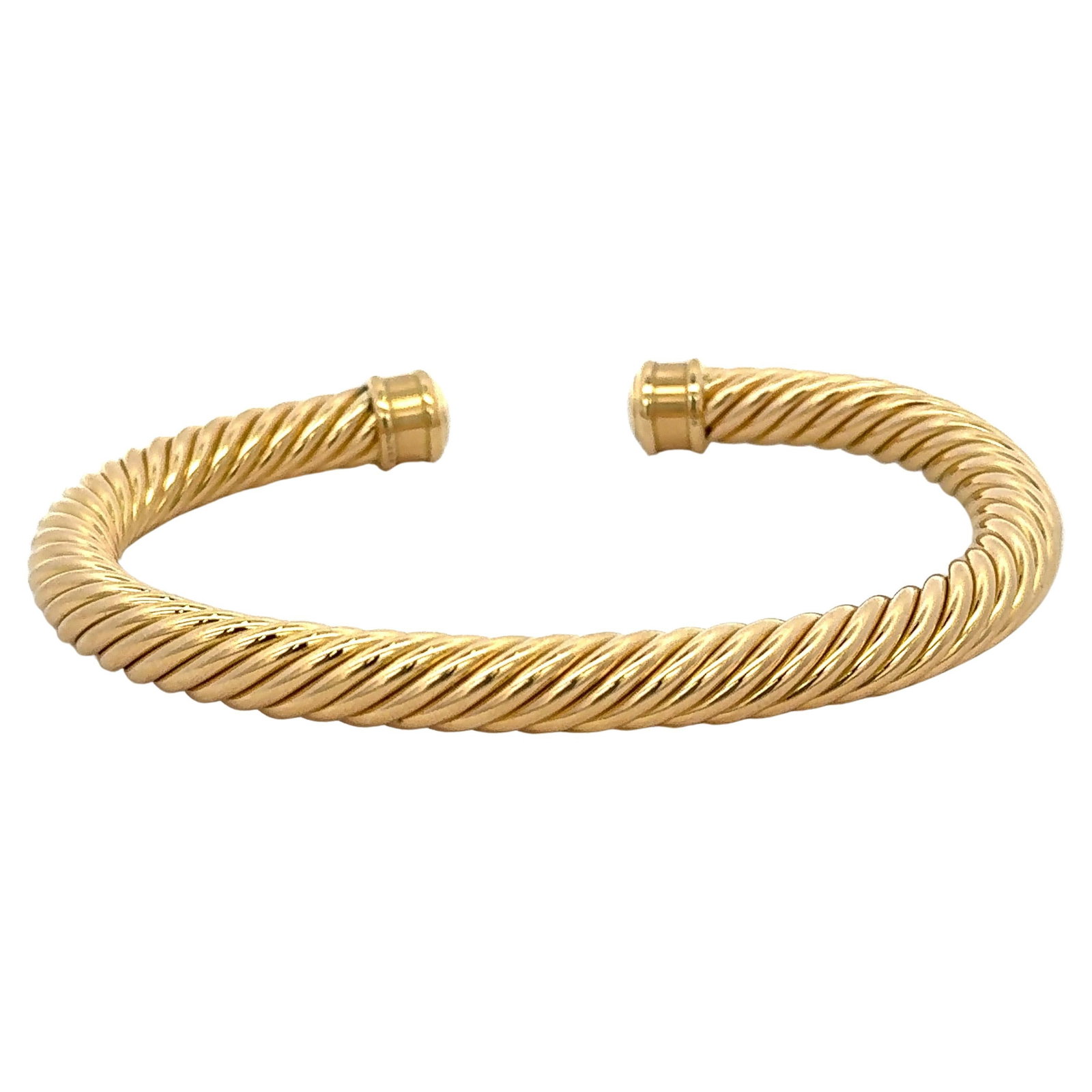 18k Yellow Gold David Yurman Cable Cuff Bracelet 7mm 23.1g: 18k Yellow Gold David Yurman Cable Cuff Bracelet 7mm 23.1g This gents David Yurman cable cuff bracelet is crafted from 18 karat yellow gold. Weighing 23.1 grams and featuring a 7 mm width, this contem