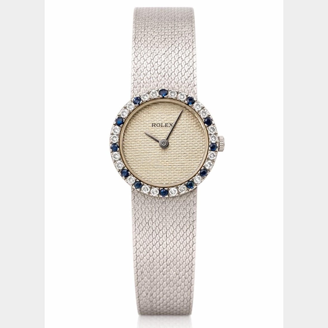 Ladies 14K White Gold Rolex Diamond Sapphire Wristwatch Manual Wind 6.5 Inch: Ladies 14K White Gold Rolex Diamond Sapphire Wristwatch Manual Wind 6.5 Inch This ladies' Rolex watch is crafted from 14K white gold and features a manual winding movement. The watch is adorned with 2