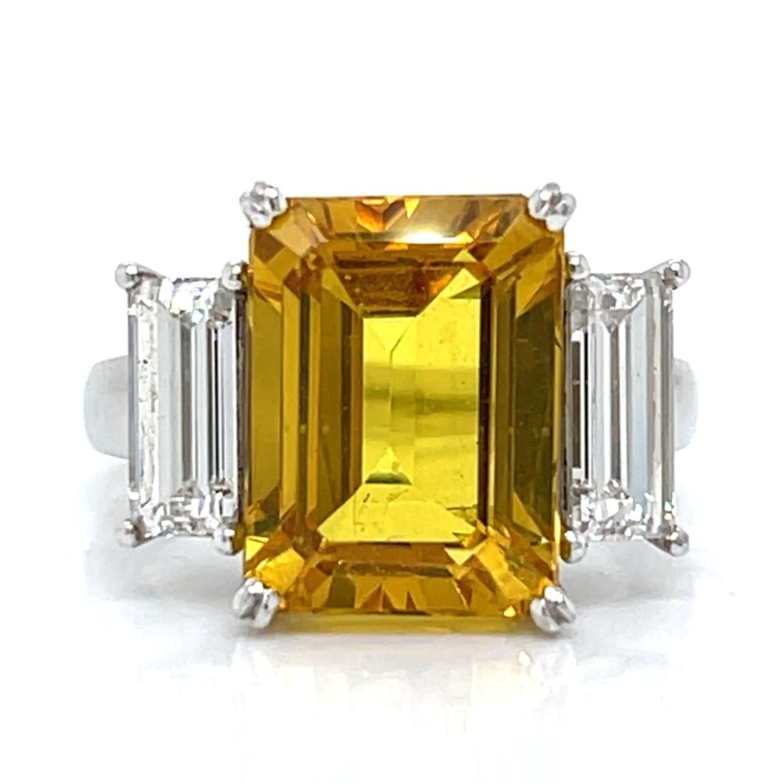 GIA Certified Platinum 8.00 Ct Yellow Sapphire Diamond Ring: GIA Certified Platinum 8.00 Ct Yellow Sapphire Diamond Ring This stunning ring features a GIA Certified yellow sapphire, weighing approximately 8.00 Ct, set in luxurious platinum. The sapphire measure