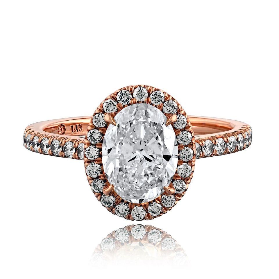 1.7 Carat Oval Diamond Ring in 14K Rose Gold with GIA Grading: 1.7 Carat Oval Diamond Ring in 14K Rose Gold with GIA Grading This pre-owned ring features a 1.70 carat oval diamond with L color and SI2 clarity, set in 14K rose gold. The ring weighs 3.1 grams and o