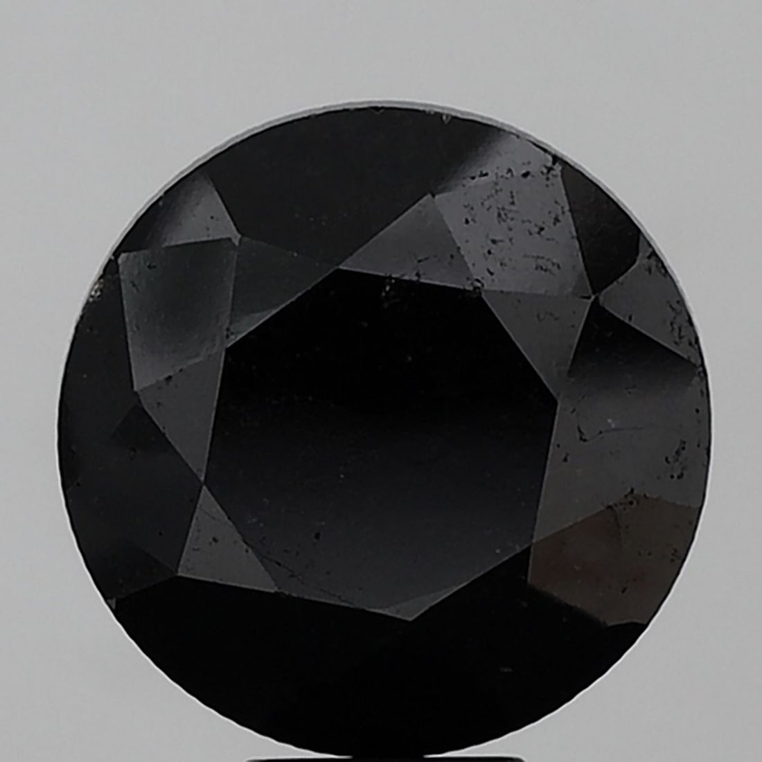 Loose Diamond - ROUND 11.92ct Black I1: Loose Diamond - ROUND 11.92ct Black I1 Source: Natural Shape: ROUND Carats: 11.92 Color: Black Certification: NONE Video: