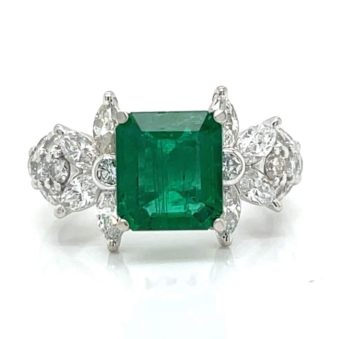 Platinum 1.62 Ct Emerald and 24 Diamond Ring F-G VVS-VS: Platinum 1.62 Ct Emerald and 24 Diamond Ring F-G VVS-VS This exquisite ring features a stunning 1.62 Ct. emerald elegantly set in luxurious platinum. Surrounding the emerald are 24 sparkling diamonds 