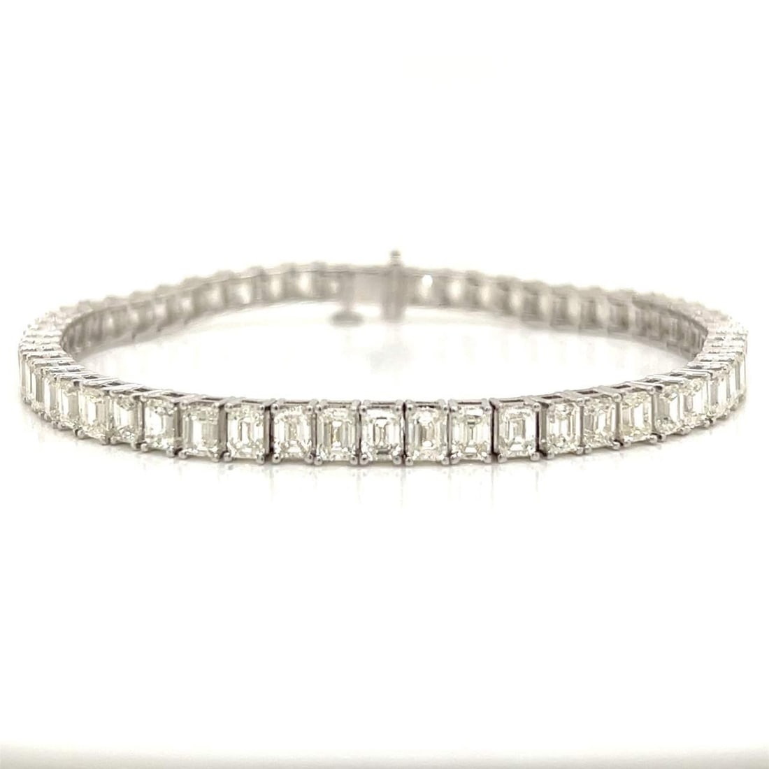 14K White Gold Diamond Tennis Bracelet 59 Baguette 11.06 Ct H-J VS1-VS2: 14K White Gold Diamond Tennis Bracelet 59 Baguette 11.06 Ct H-J VS1-VS2 This exquisite 14K white gold diamond tennis bracelet showcases a stunning array of 59 baguette diamonds with a total weight of 