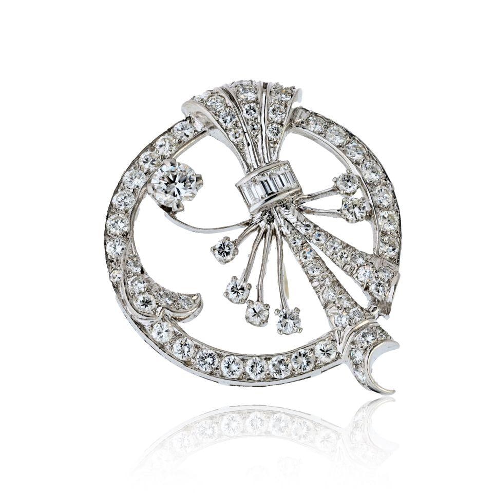Platinum Brooch 4.00ct Round Baguette Cut Diamond Floral Design: Platinum Brooch 4.00ct Round Baguette Cut Diamond Floral Design This exquisite brooch is expertly crafted in platinum, showcasing a graceful circular design adorned with floral and spray-inspired moti
