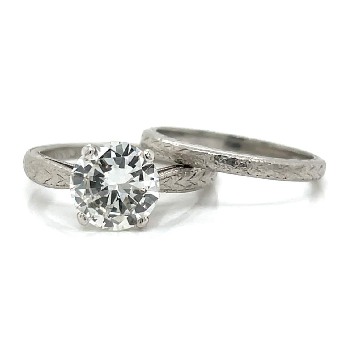 Platinum GIA Certified 1.95 Ct Diamond Ring Set with Additional Diamonds: Platinum GIA Certified 1.95 Ct Diamond Ring Set with Additional Diamonds This exquisite Platinum GIA Certified Diamond Ring Set features a stunning 1.95 Ct. main diamond, known for its G Color and VVS