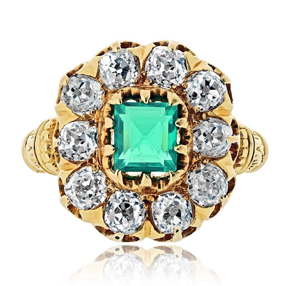 Estate Ring in 18K Gold with 1.14ct Colombian Emerald and Diamonds: Estate Ring in 18K Gold with 1.14ct Colombian Emerald and Diamonds This vintage estate ring features a vivid 1.14 carat natural Colombian emerald set in 18K yellow gold. The emerald is surrounded by t