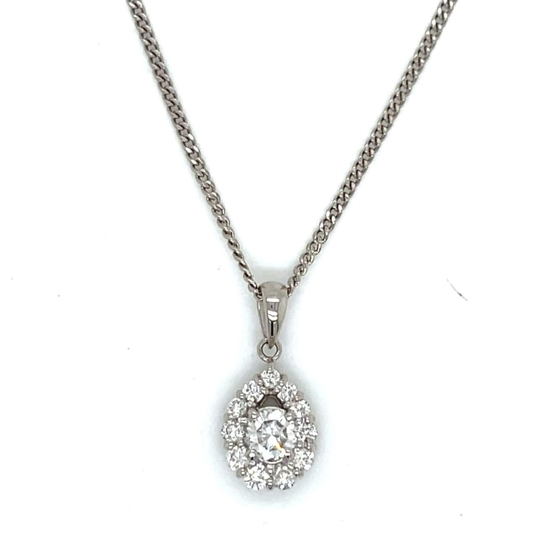 Elegant Platinum Diamond Pendant with 0.36 Ct Diamonds: Elegant Platinum Diamond Pendant with 0.36 Ct Diamonds This exquisite Platinum Diamond Pendant features a stunning center diamond weighing 0.36 Ct, surrounded by 11 additional diamonds, also totaling 