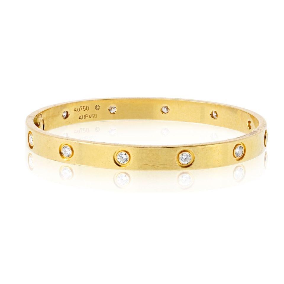 Love Collection 18K Yellow Gold Bangle with 10 Diamonds Size 17: Love Collection 18K Yellow Gold Bangle with 10 Diamonds Size 17 This iconic Cartier Love bangle bracelet is crafted in solid 18K yellow gold and features 10 diamonds with a total approximate weight of