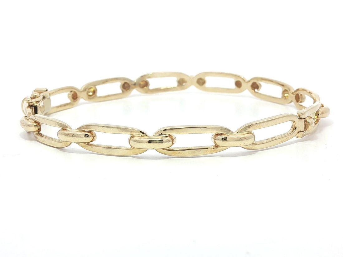 14k Yellow Gold Paperclip Hinged Bangle Bracelet 6.75in: 14k Yellow Gold Paperclip Hinged Bangle Bracelet 6.75in This exquisite 14k Yellow Gold Open Link Paperclip Style Stackable Hinged Bangle Bracelet is a stunning addition to any jewelry collection. Craf
