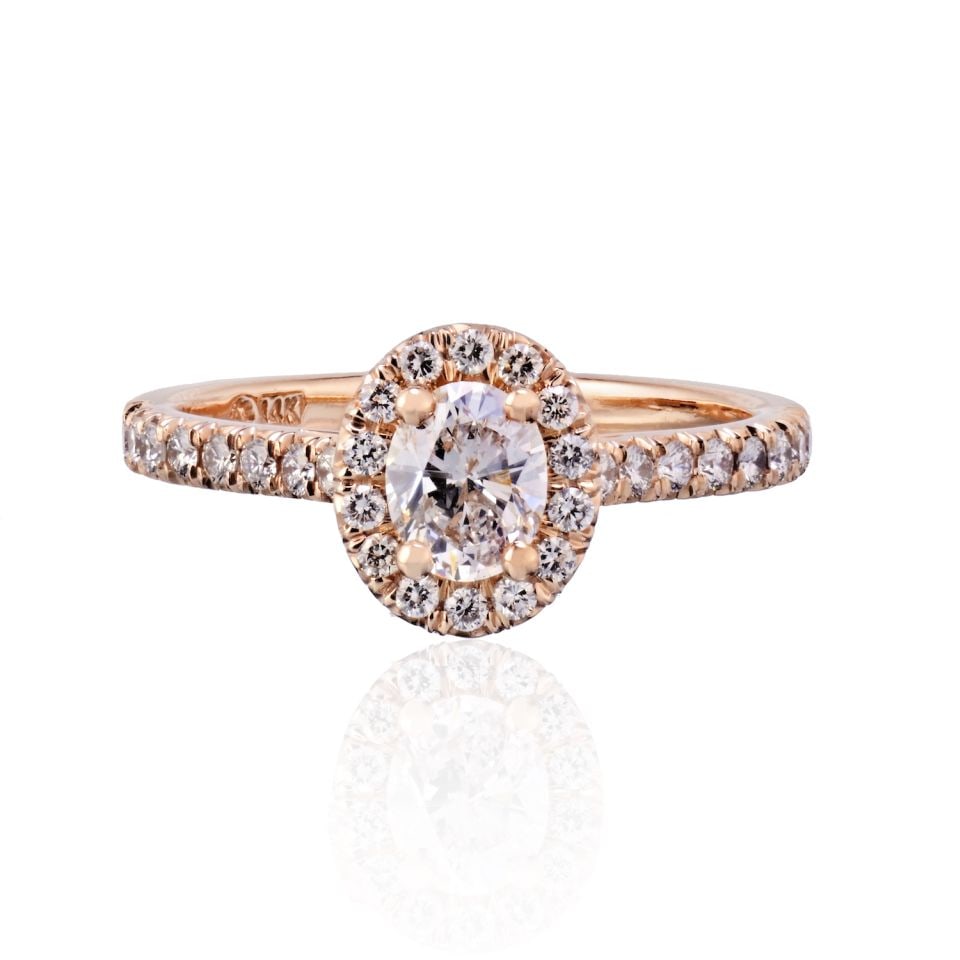 GIA Certified 0.55ct D VS2 Oval Diamond Halo Engagement Ring 14K Rose Gold Size 7: GIA Certified 0.55ct D VS2 Oval Diamond Halo Engagement Ring 14K Rose Gold Size 7 This elegant engagement ring features a 0.55 carat oval cut diamond with D color and VS2 clarity, set in a halo of rou