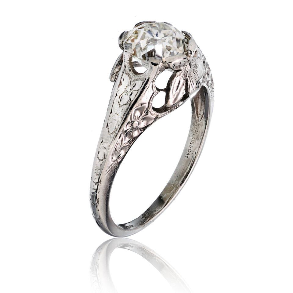 Platinum Vintage Ring With 1.25ct Old Mine Cut GIA Diamond I VS2: Platinum Vintage Ring With 1.25ct Old Mine Cut GIA Diamond I VS2 This pre-owned ring features a 1.25 carat old mine cut diamond graded I color and VS2 clarity, certified by GIA. The ring is crafted fr