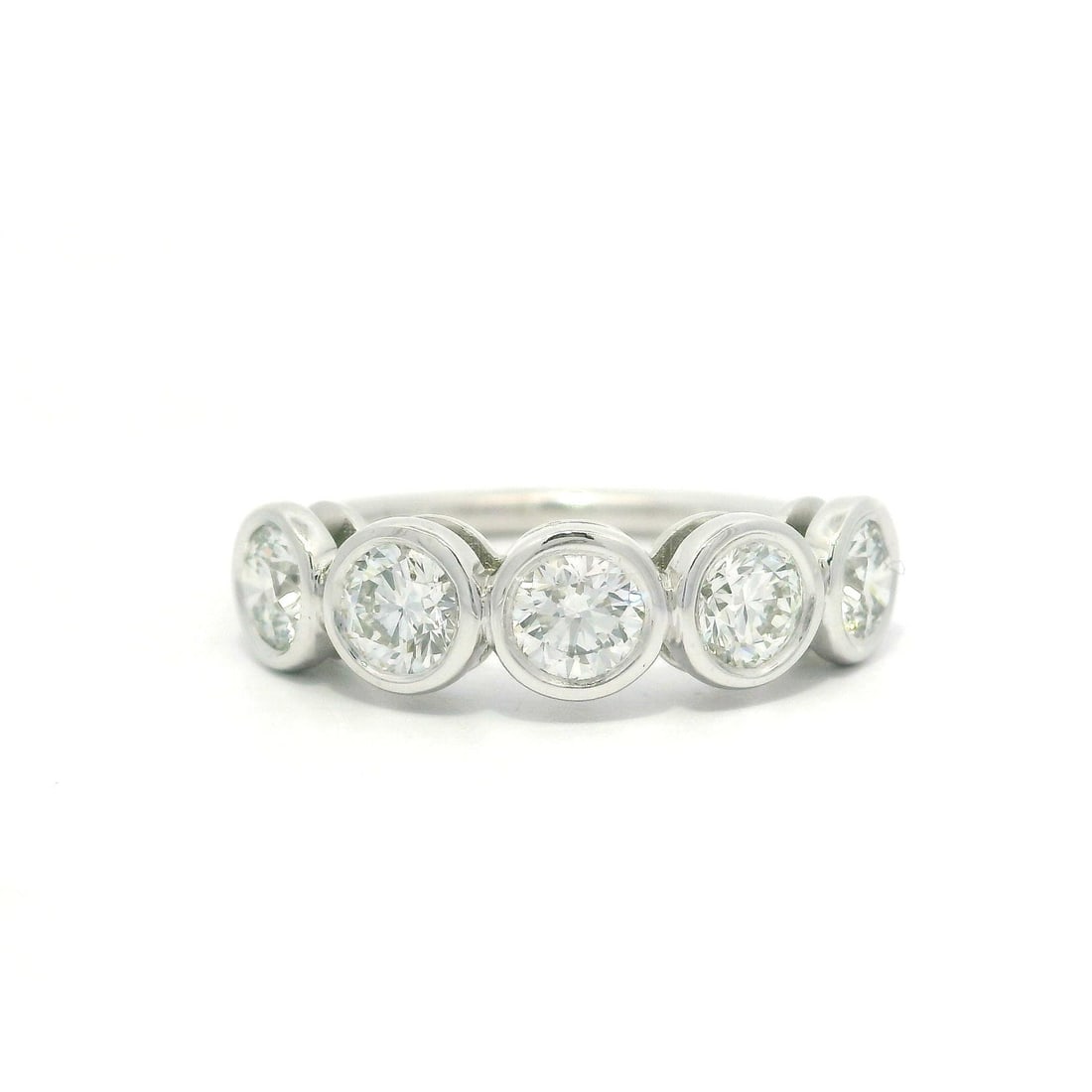 Platinum 1.28ctw 5 Diamond Bezel Set Stackable Band Ring: Platinum 1.28ctw 5 Diamond Bezel Set Stackable Band Ring This stunning stackable band ring is crafted from high-quality platinum and features a total carat weight of 1.28ctw, showcasing five natural r