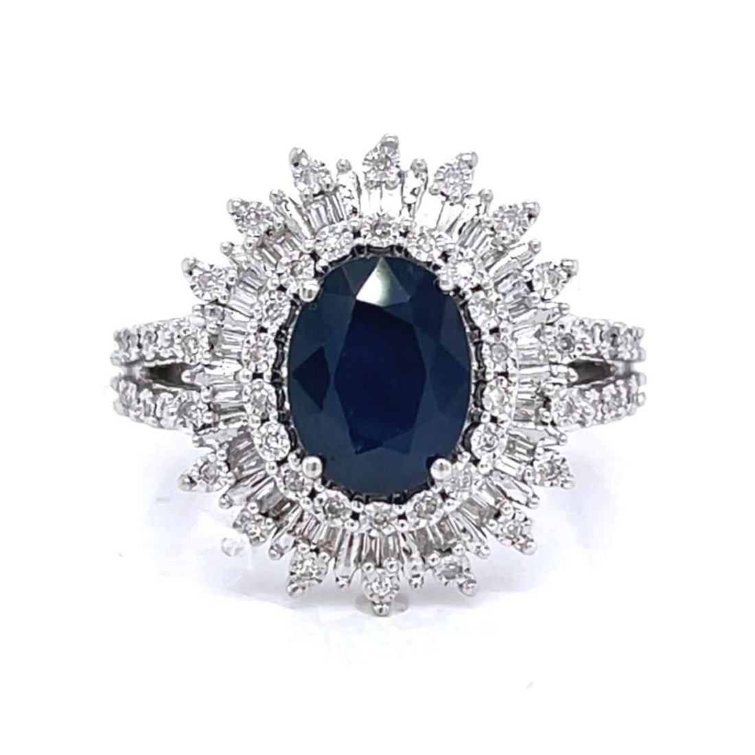 14K White Gold Sapphire and Diamond Ring 2.00 Ct with 1.00 Ct Diamonds: 14K White Gold Sapphire and Diamond Ring 2.00 Ct with 1.00 Ct Diamonds This stunning ring features a vibrant 2.00 Ct. sapphire, elegantly set in luxurious 14K white gold. Accenting the sapphire are ap