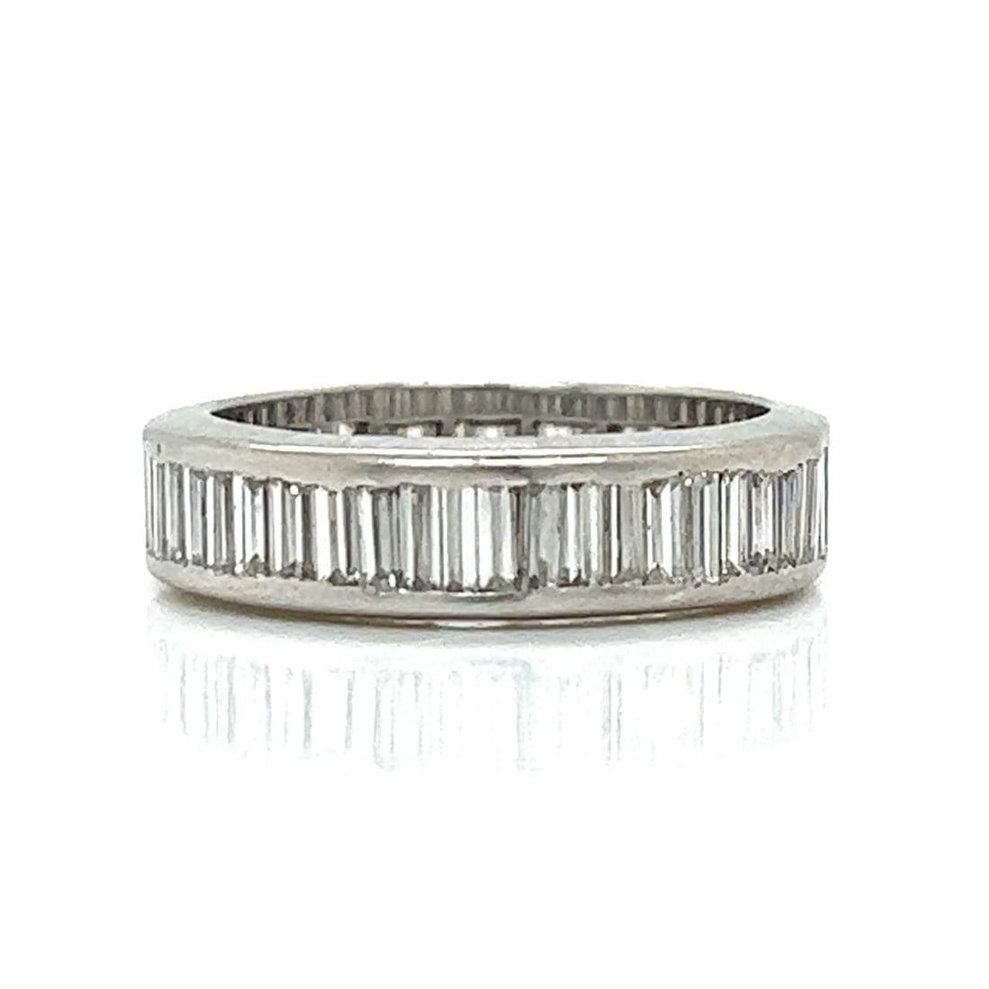 Art Deco Platinum Eternity Ring 3.50 Ct Baguette Diamonds G-H VVS-VS: Art Deco Platinum Eternity Ring 3.50 Ct Baguette Diamonds G-H VVS-VS This exquisite Art Deco eternity ring showcases a stunning array of baguette diamonds, totaling approximately 3.50 carats. Crafted 
