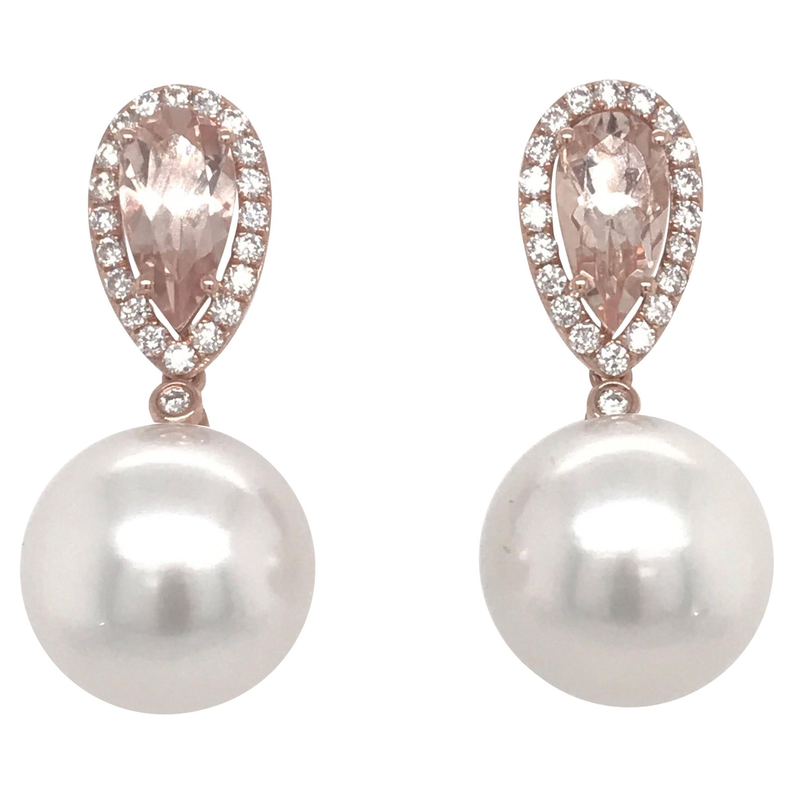 Drop Earrings With Morganite South Sea Pearl and Diamonds in 18K Rose Gold: Drop Earrings With Morganite South Sea Pearl and Diamonds in 18K Rose Gold These 18K rose gold drop earrings feature two morganite stones totaling 2.03 carats, each surrounded by round brilliant diamo