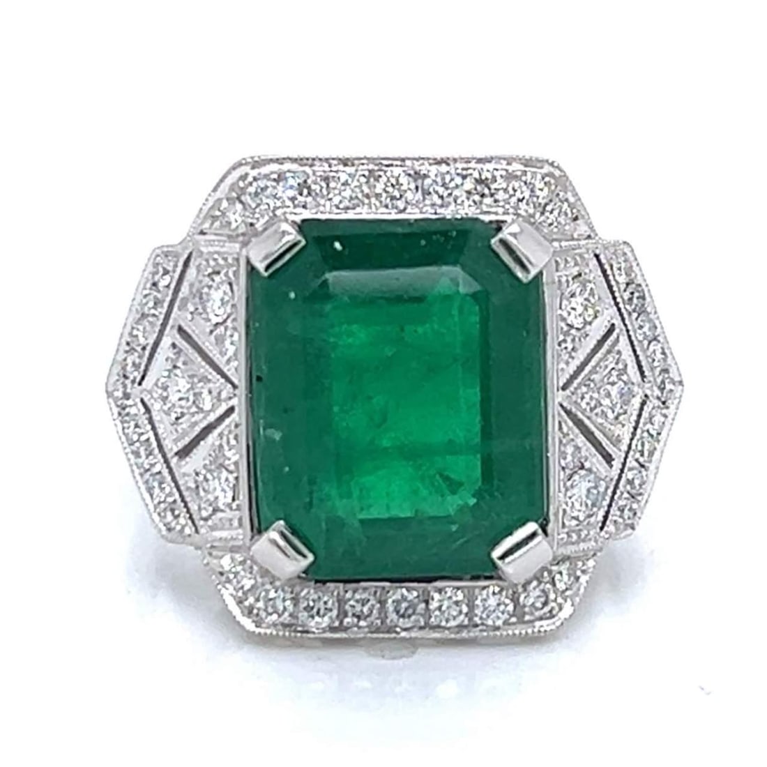 Platinum 7.85 Ct Emerald Diamond Ring 70 Stones F-G VVS-VS: Platinum 7.85 Ct Emerald Diamond Ring 70 Stones F-G VVS-VS This exquisite Platinum ring features a stunning 7.85 Ct. Emerald, beautifully complemented by 70 Diamonds with an approximate total weight o