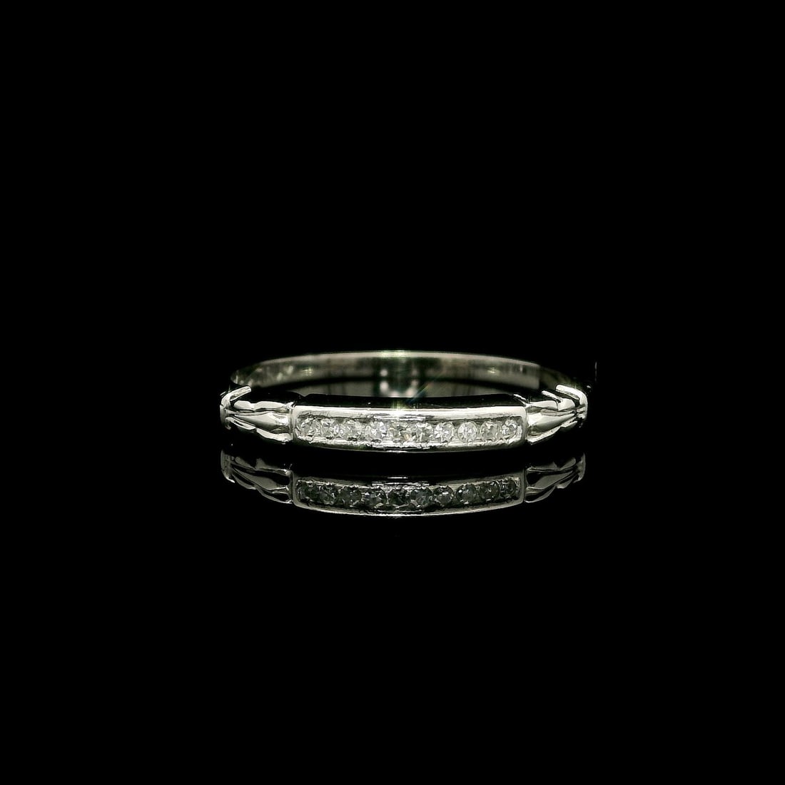 Antique Platinum Petite Diamond Buckle Band Ring 0.06ctw: Antique Platinum Petite Diamond Buckle Band Ring 0.06ctw This exquisite antique platinum band ring features a petite buckle style design, elegantly adorned with ten natural, single cut diamonds. The c