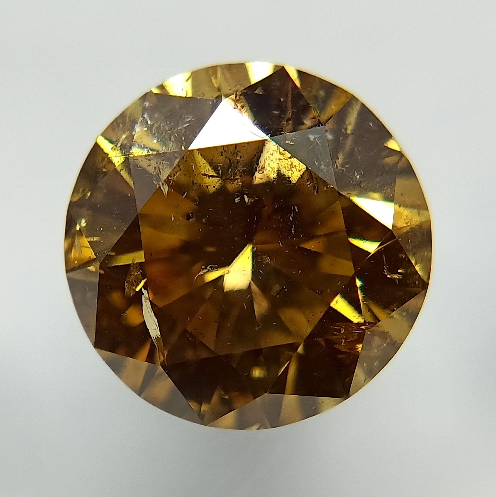 Loose Diamond - ROUND 1.5ct Fancy Deep Brownish Yellow: Loose Diamond - ROUND 1.5ct Fancy Deep Brownish Yellow Source: Natural Shape: ROUND Carats: 1.5 Color: Fancy Deep Brownish Yellow Certification: GIA The Diamond Depot Guarantee: All items in this auct