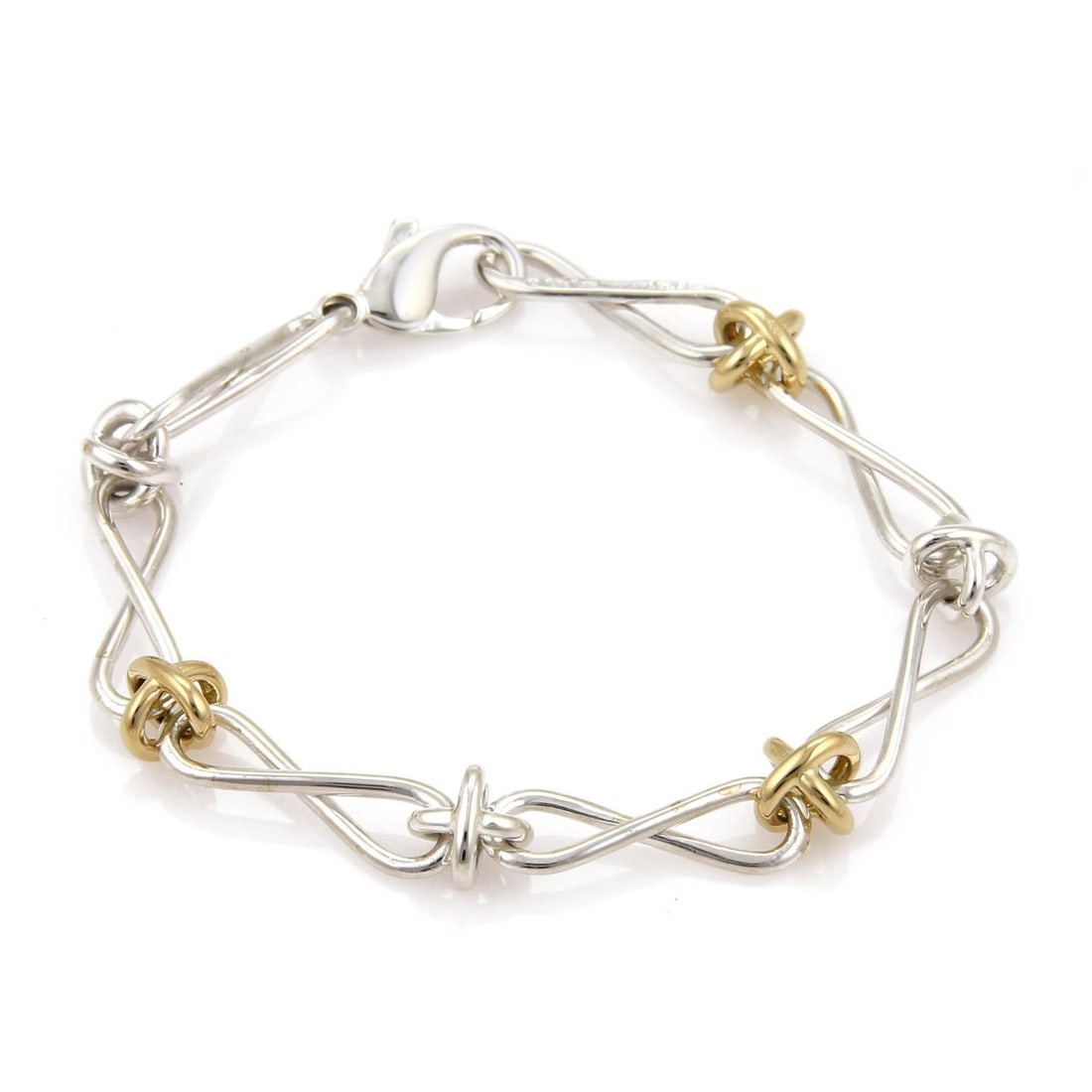 Tiffany & Co. Paloma Picasso Infinity Link Bracelet Sterling Silver 18k Gold: Tiffany & Co. Paloma Picasso Infinity Link Bracelet Sterling Silver 18k Gold Elevate your accessory collection with this exquisite Tiffany & Co. Infinity Link Bracelet designed by Paloma Picasso. This