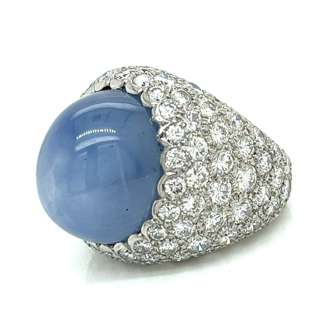 Platinum 40.00 Ct Star Sapphire Diamond Ring 106 Stones E-F VVS: Platinum 40.00 Ct Star Sapphire Diamond Ring 106 Stones E-F VVS This exquisite platinum ring features a stunning 40.00 ct. star sapphire at its center, surrounded by a total of 106 diamonds that weigh