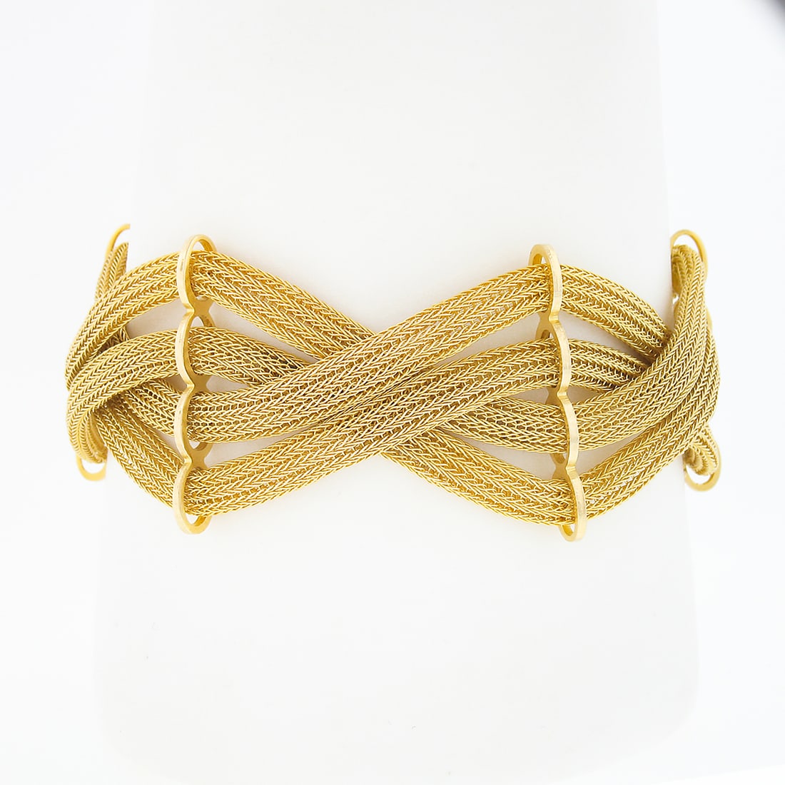 Vintage 18k Yellow Gold Wide Crossover Mesh Link Bracelet: Vintage 18k Yellow Gold Wide Crossover Mesh Link Bracelet This exquisite vintage bracelet is crafted from solid 18k yellow gold, showcasing a striking crossover woven braid design. Weighing 37.59
