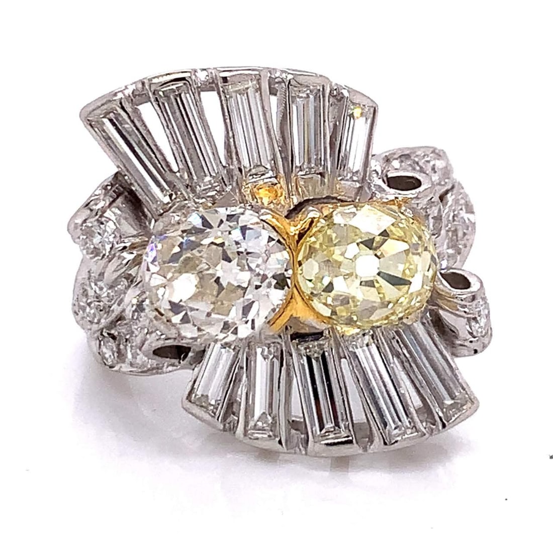 Art Deco 1.76 Ct Yellow Diamond Ring with 24 Accent Diamonds: Art Deco 1.76 Ct Yellow Diamond Ring with 24 Accent Diamonds This exquisite Art Deco ring showcases a stunning 1.76 Ct. Fancy Light Yellow Diamond, complemented by an approximately 1.50 Ct. diamond of