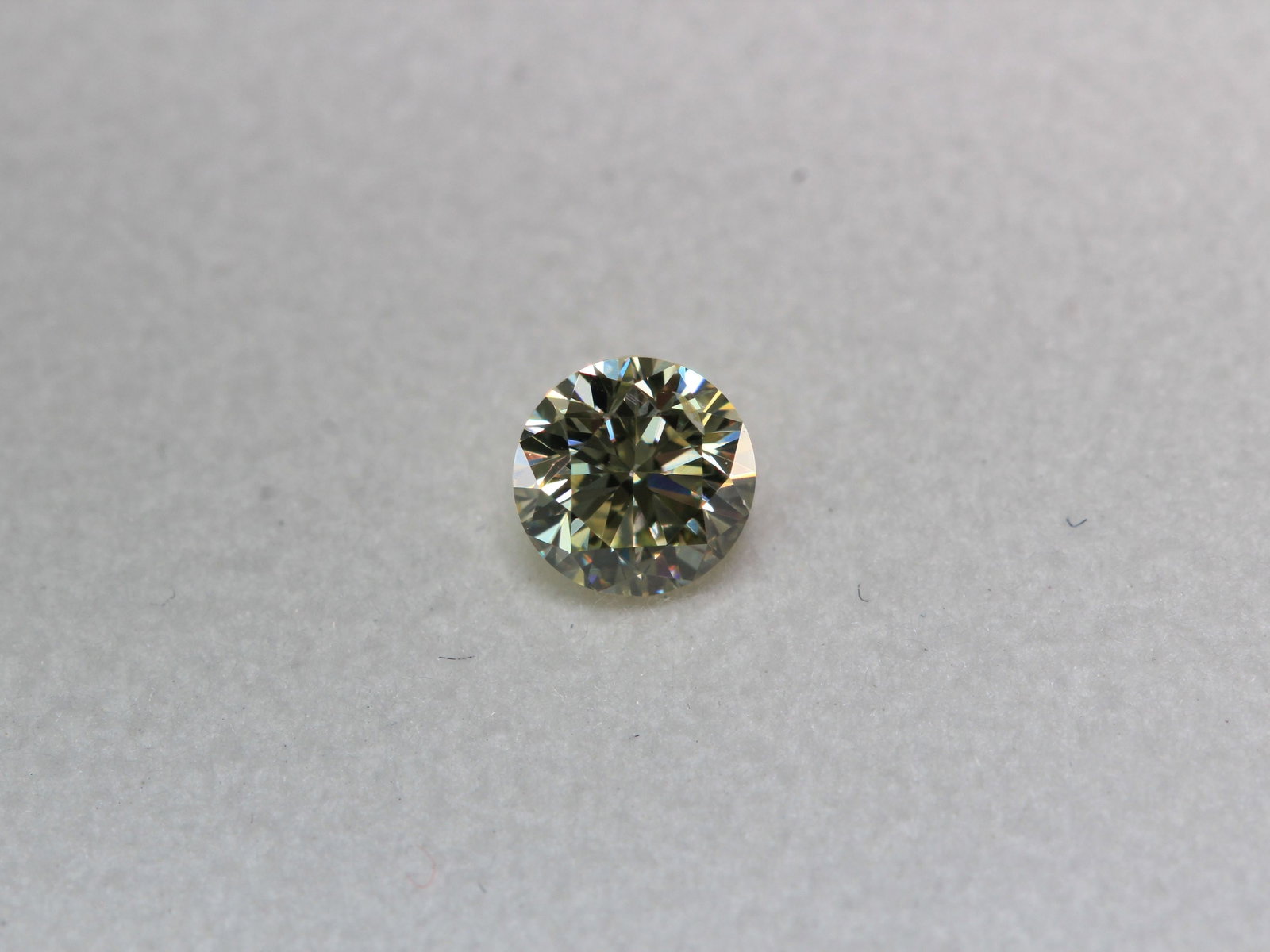 Loose Diamond - ROUND 0.25ct Fancy Light Yellow SI2: Loose Diamond - ROUND 0.25ct Fancy Light Yellow SI2 Source: Natural Shape: ROUND Carats: 0.25 Color: Fancy Light Yellow Certification: IGI Video: