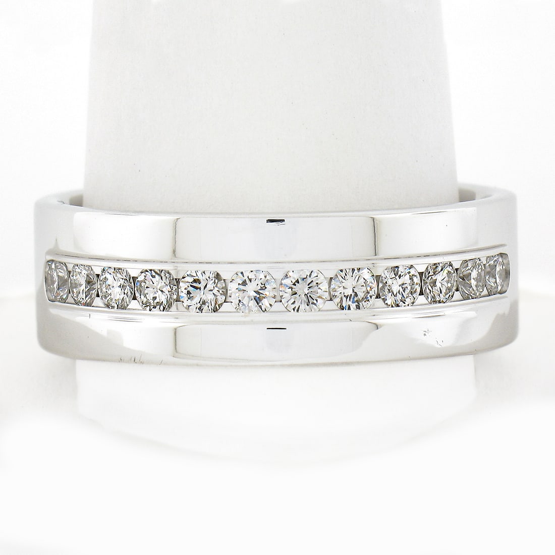 Men's 14K White Gold Diamond Band Ring 0.60ctw Channel Set: Men's 14K White Gold Diamond Band Ring 0.60ctw Channel Set This exquisite men's band ring is crafted from solid 14K white gold, featuring a stunning channel set of 12 round brilliant cut natural diamo