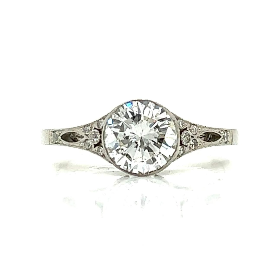 Platinum Diamond Ring 1.15 Ct G Color SI2 with 16 Accent Diamonds: Platinum Diamond Ring 1.15 Ct G Color SI2 with 16 Accent Diamonds This exquisite platinum diamond ring features a stunning center diamond weighing approximately 1.15 carats, showcasing a G color and S